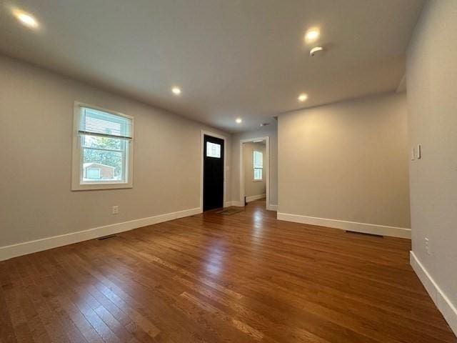 spare room featuring dark hardwood / wood-style floors