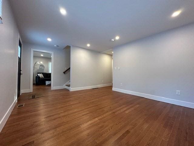 spare room featuring dark hardwood / wood-style flooring