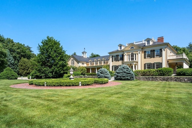 495 Hugh Cargill Rd, Concord, MA 01742 - view of front of home with a chimney and a front lawn