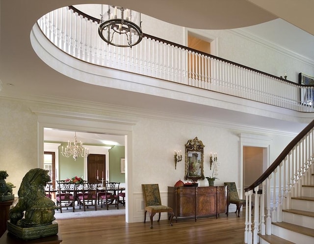495 Hugh Cargill Rd, Concord, MA 01742 - interior space featuring crown molding, stairs, wood finished floors, and a chandelier