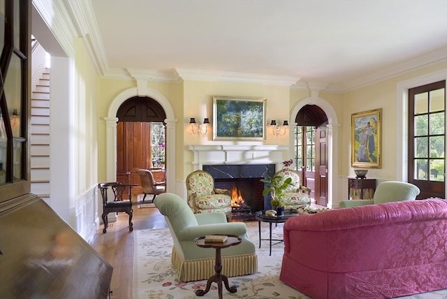495 Hugh Cargill Rd, Concord, MA 01742 - living area with ornamental molding, a fireplace, and wood finished floors