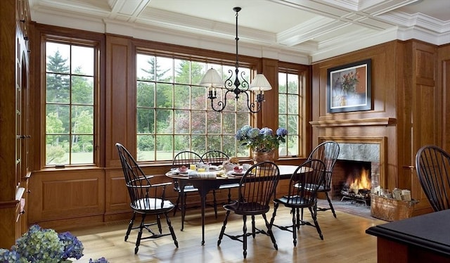 495 Hugh Cargill Rd, Concord, MA 01742 - dining space with light wood-type flooring, beam ceiling, an inviting chandelier, ornamental molding, and coffered ceiling