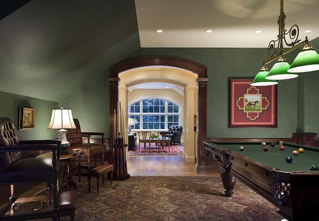 495 Hugh Cargill Rd, Concord, MA 01742 - recreation room with vaulted ceiling, decorative columns, recessed lighting, and wood finished floors