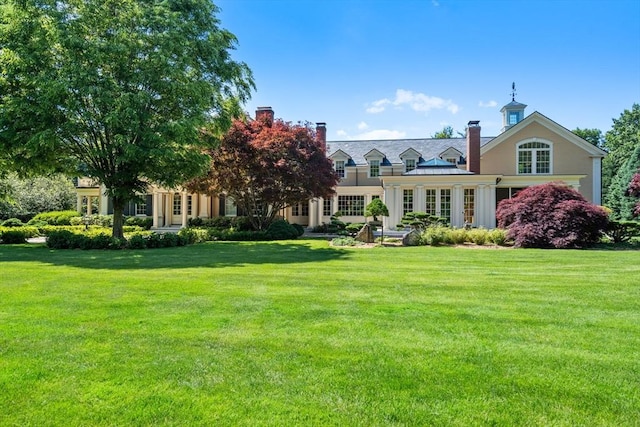 495 Hugh Cargill Rd, Concord, MA 01742 - rear view of house with a lawn