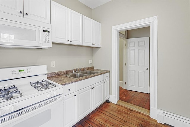 kitchen featuring white cabinetry, sink, white appliances, and dark hardwood / wood-style floors