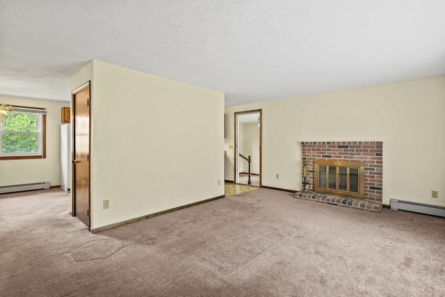 395 Franklin Rd, Fitchburg, MA 01420 - unfurnished living room with a baseboard radiator, light colored carpet, a fireplace, and a textured ceiling