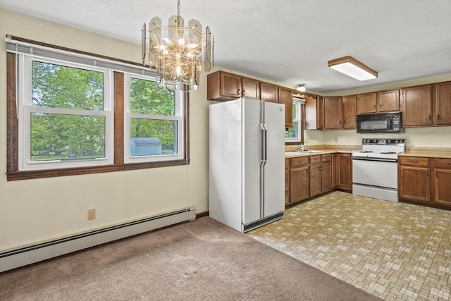 395 Franklin Rd, Fitchburg, MA 01420 - kitchen with white appliances, baseboard heating, a chandelier, and plenty of natural light