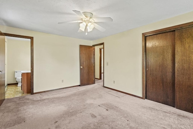395 Franklin Rd, Fitchburg, MA 01420 - unfurnished bedroom with a closet, light carpet, baseboards, and ensuite bathroom