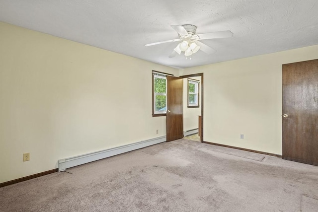 395 Franklin Rd, Fitchburg, MA 01420 - spare room with baseboard heating, baseboards, and carpet flooring