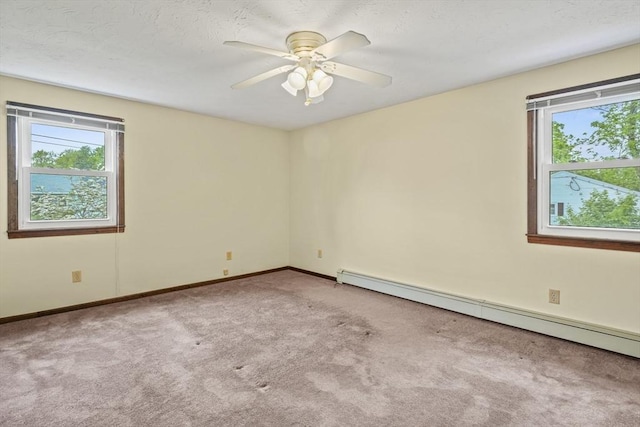395 Franklin Rd, Fitchburg, MA 01420 - carpeted empty room featuring a baseboard radiator, healthy amount of natural light, and baseboards