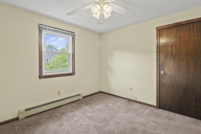 395 Franklin Rd, Fitchburg, MA 01420 - unfurnished bedroom with baseboard heating, carpet floors, baseboards, and ceiling fan