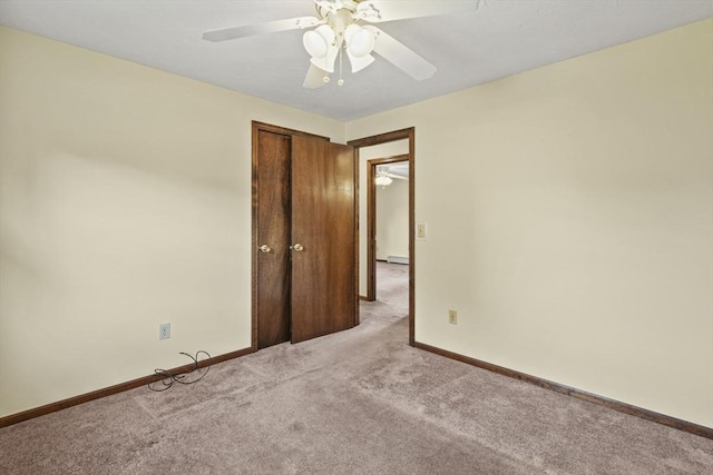 395 Franklin Rd, Fitchburg, MA 01420 - empty room with light carpet, a ceiling fan, baseboards, and baseboard heating