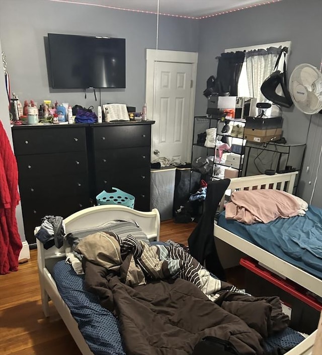 bedroom with wood finished floors