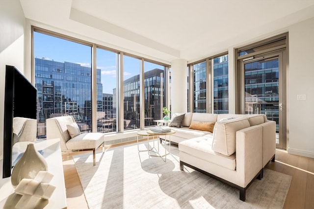 sunroom / solarium featuring a city view