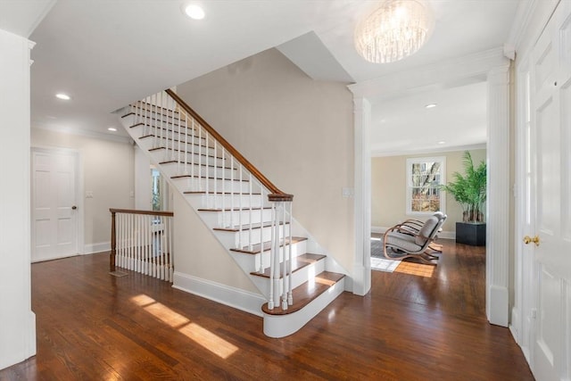 staircase featuring recessed lighting, baseboards, wood finished floors, and crown molding