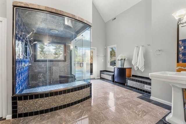 full bath with baseboards, visible vents, high vaulted ceiling, a stall shower, and marble finish floor