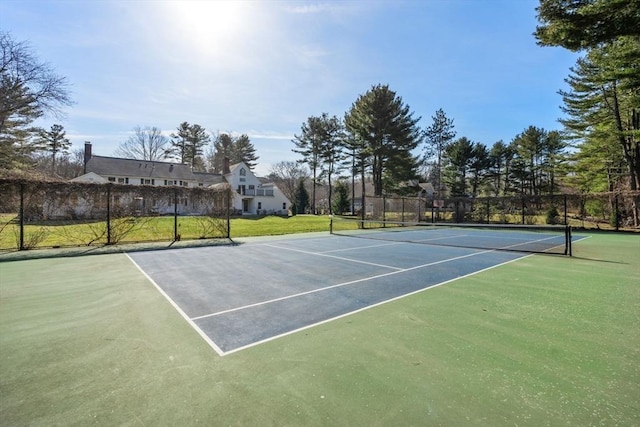 view of sport court with fence