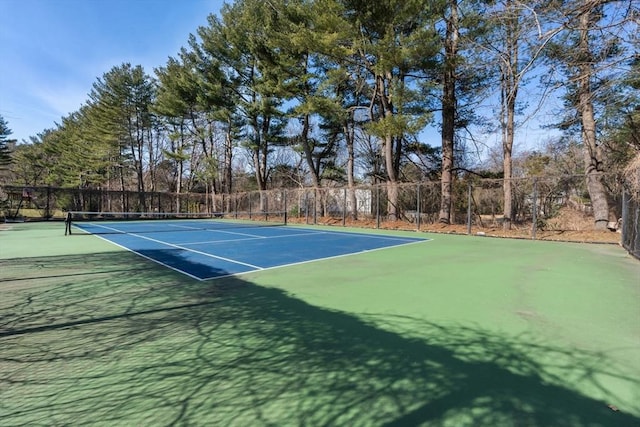 view of sport court with fence