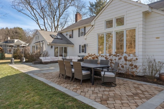 exterior space with an outdoor living space and outdoor dining area