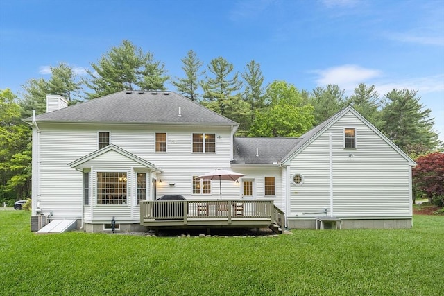21 Butterfield Ln, Westford, MA 01886 - rear view of property featuring a deck, a lawn, a chimney, and cooling unit