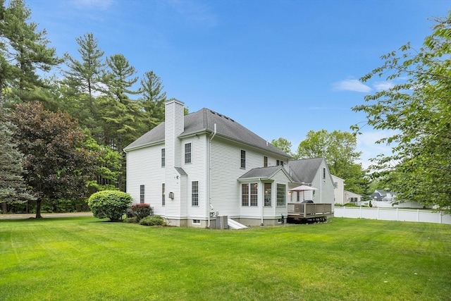 21 Butterfield Ln, Westford, MA 01886 - rear view of house featuring a chimney and a shingled roof