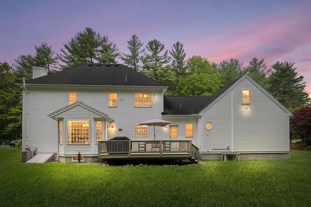 21 Butterfield Ln, Westford, MA 01886 - rear view of property featuring a deck, a lawn, a chimney, and central AC unit