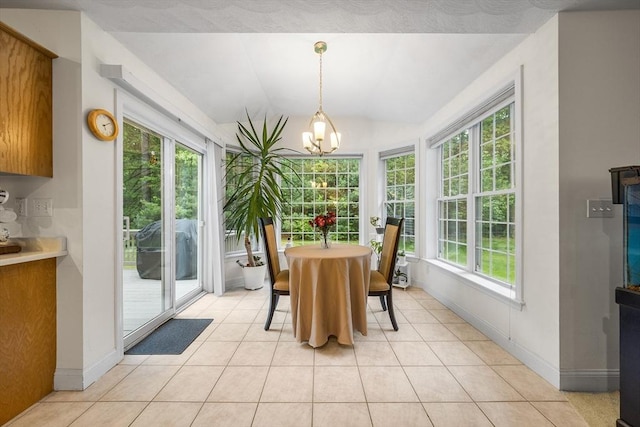 21 Butterfield Ln, Westford, MA 01886 - dining room with light tile patterned floors, a chandelier, lofted ceiling, and baseboards