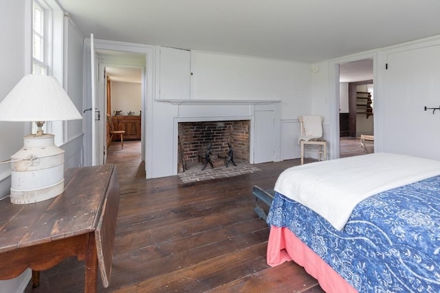 40 Scotchmans Ln, West Tisbury, MA 02575 - bedroom with wood-type flooring and a fireplace