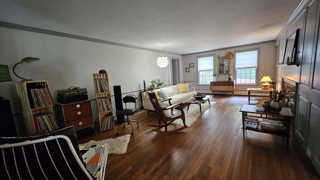 living room with ornamental molding and wood finished floors