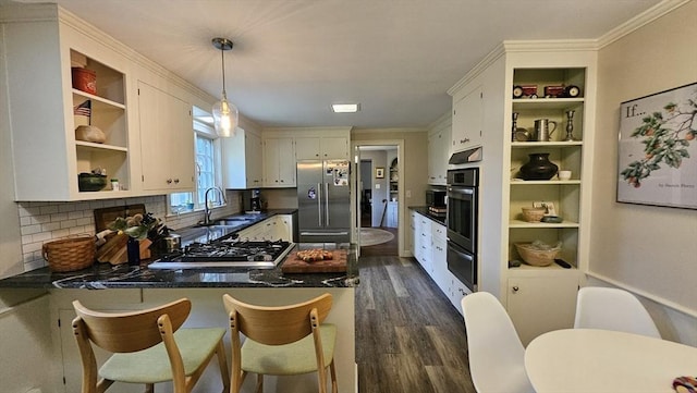 kitchen with appliances with stainless steel finishes, open shelves, a peninsula, a warming drawer, and dark wood-style flooring