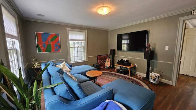 living room with ornamental molding, wood finished floors, and baseboards