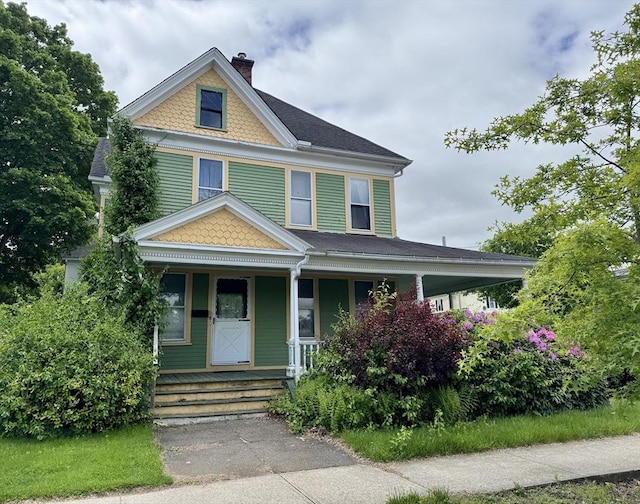 78 Allyn St, Holyoke, MA 01040 - victorian-style house featuring a chimney and covered porch
