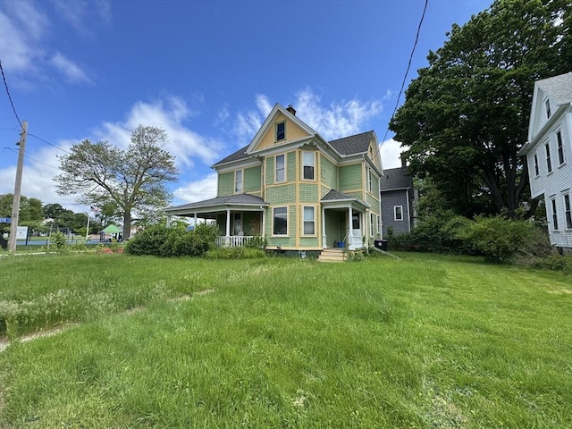78 Allyn St, Holyoke, MA 01040 - victorian home featuring covered porch and a chimney