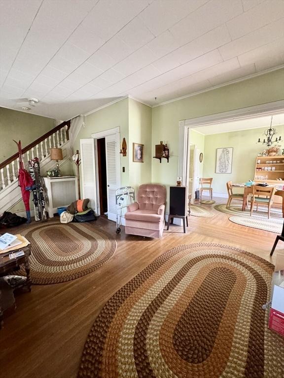 78 Allyn St, Holyoke, MA 01040 - living area featuring wood finished floors and ornamental molding