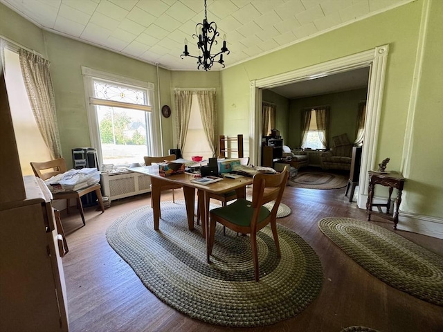 78 Allyn St, Holyoke, MA 01040 - dining room featuring an office area, radiator heating unit, wood finished floors, ornamental molding, and a chandelier