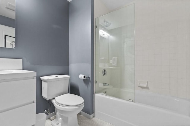 full bath with vanity, bathing tub / shower combination, toilet, baseboards, and tile patterned floors