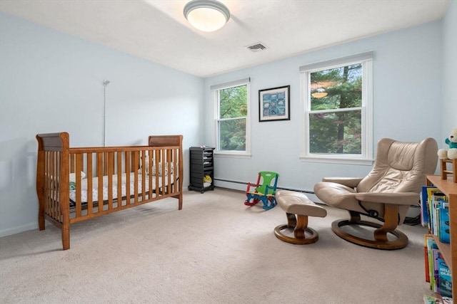 67 Flanagan Dr, Framingham, MA 01701 - bedroom with carpet flooring, a crib, and baseboard heating