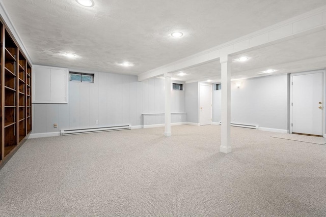 67 Flanagan Dr, Framingham, MA 01701 - finished basement featuring a baseboard radiator, carpet, and recessed lighting