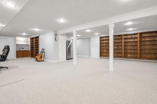 67 Flanagan Dr, Framingham, MA 01701 - finished basement featuring freestanding refrigerator, recessed lighting, carpet flooring, built in features, and crown molding