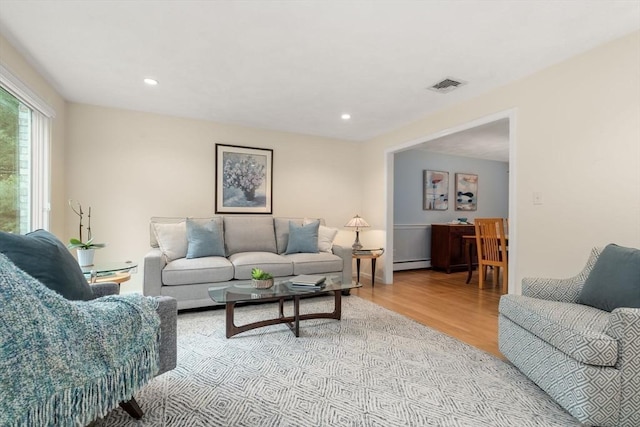 67 Flanagan Dr, Framingham, MA 01701 - living room featuring baseboard heating, light wood-style floors, and recessed lighting