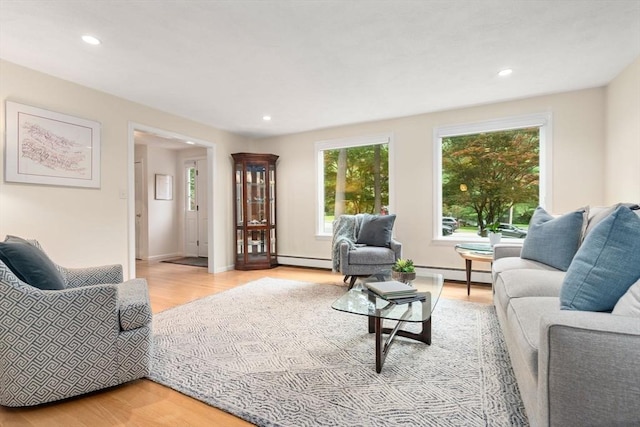 67 Flanagan Dr, Framingham, MA 01701 - living room with baseboard heating, a baseboard heating unit, light wood-type flooring, and recessed lighting