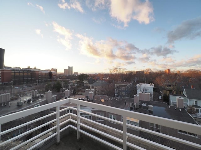 view of balcony at dusk