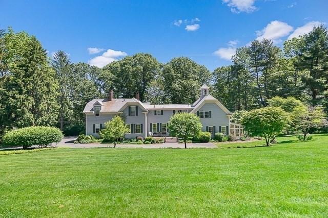 185 Woodland St, Natick, MA 01760 - view of front facade featuring a front yard