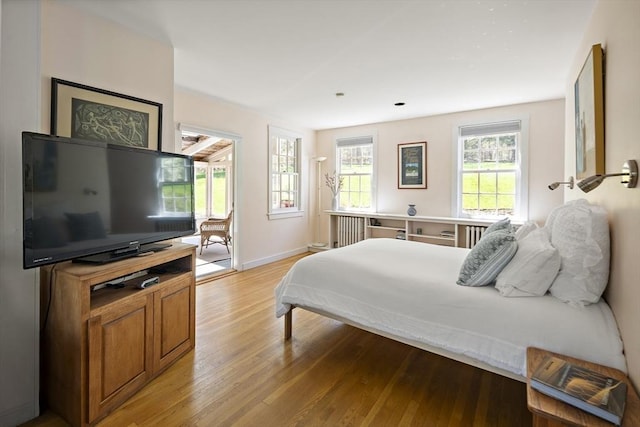 185 Woodland St, Natick, MA 01760 - bedroom featuring light wood-type flooring, baseboards, and access to exterior