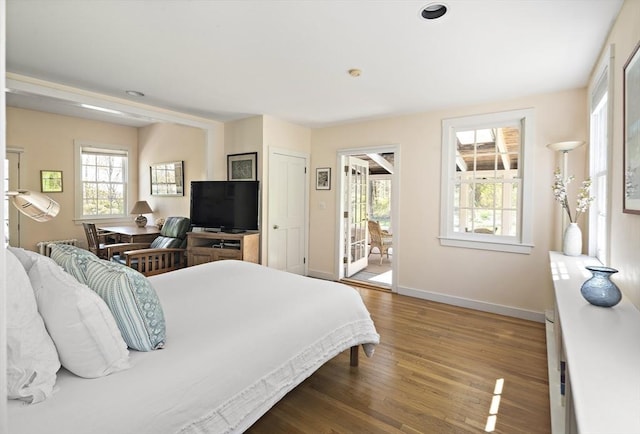 185 Woodland St, Natick, MA 01760 - bedroom with multiple windows, wood finished floors, baseboards, and recessed lighting