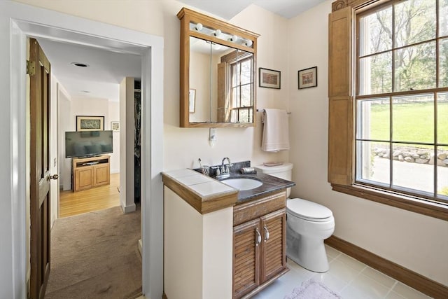 185 Woodland St, Natick, MA 01760 - bathroom with vanity, toilet, and baseboards