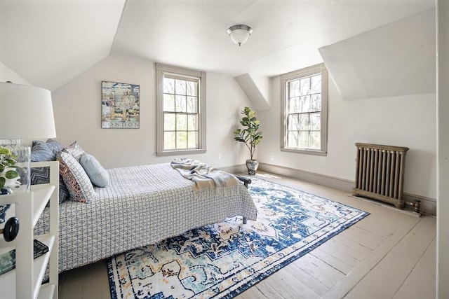 185 Woodland St, Natick, MA 01760 - bedroom with lofted ceiling, hardwood / wood-style flooring, and radiator heating unit