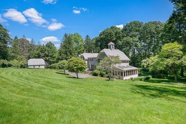 185 Woodland St, Natick, MA 01760 - view of green lawn featuring a sunroom and view of wooded area