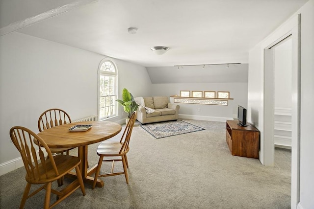 185 Woodland St, Natick, MA 01760 - carpeted dining room featuring lofted ceiling, baseboards, and rail lighting