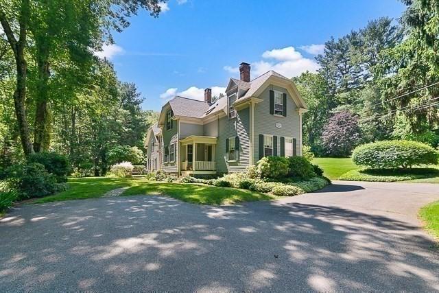 185 Woodland St, Natick, MA 01760 - view of home's exterior featuring a chimney and a yard